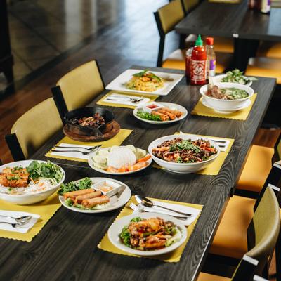 Interior, a dining table laden with multiple dishes.