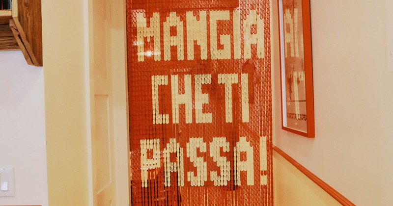 Italian restaurant beaded curtain with an Italian phrase