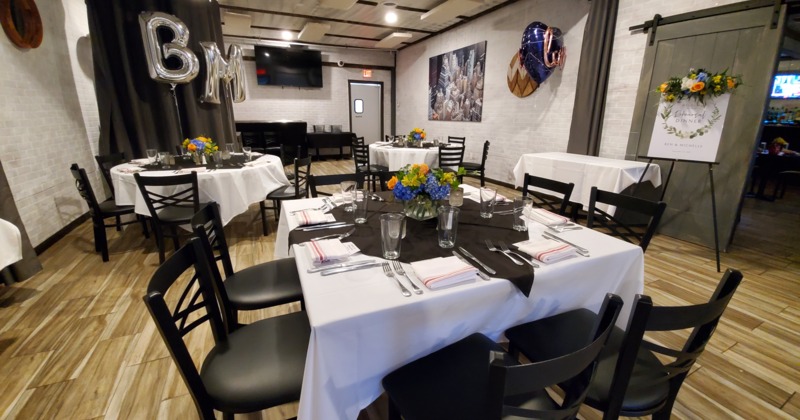 Interior, tables and chairs near entrance