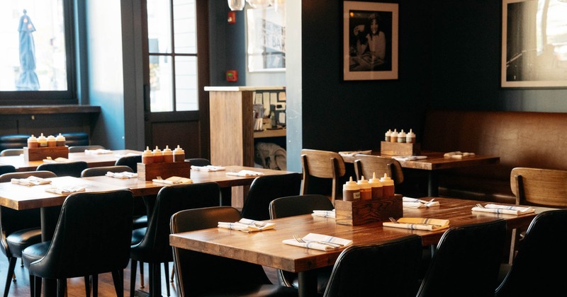 Interior, lined up dining tables with table items