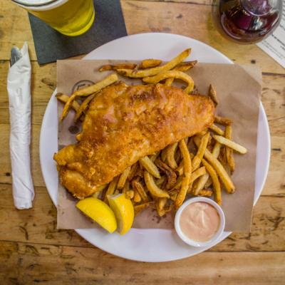 Served fish and chips on the table.