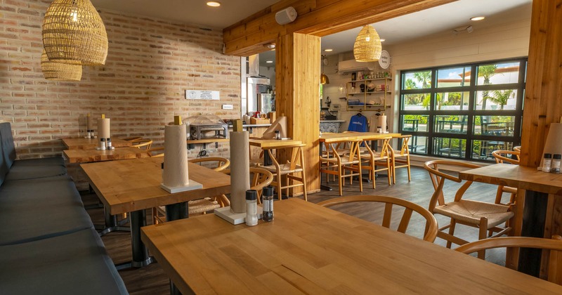 Interior, banquette seating area, tables and chairs