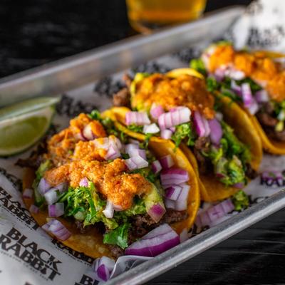 Asada tacos served, closeup
