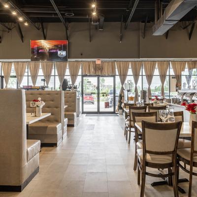 Spacious restaurant dining area with booths and buffet stations.