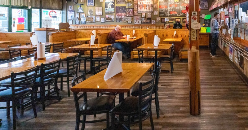Interior, tables and chairs, wall decoration, two guests
