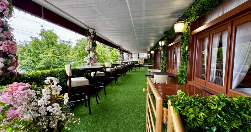 Exterior, seating area outside with greenery and floral decorations