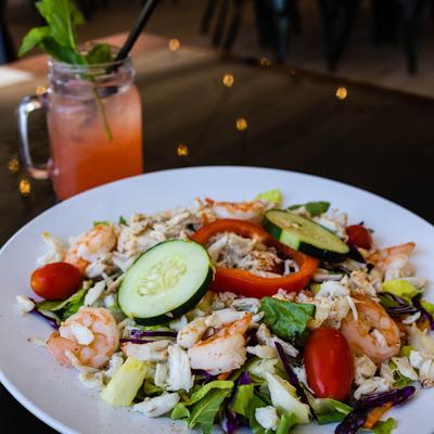 Crab meat and shrimp served over garden salad