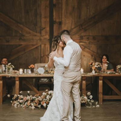 The bride and groom hugging.