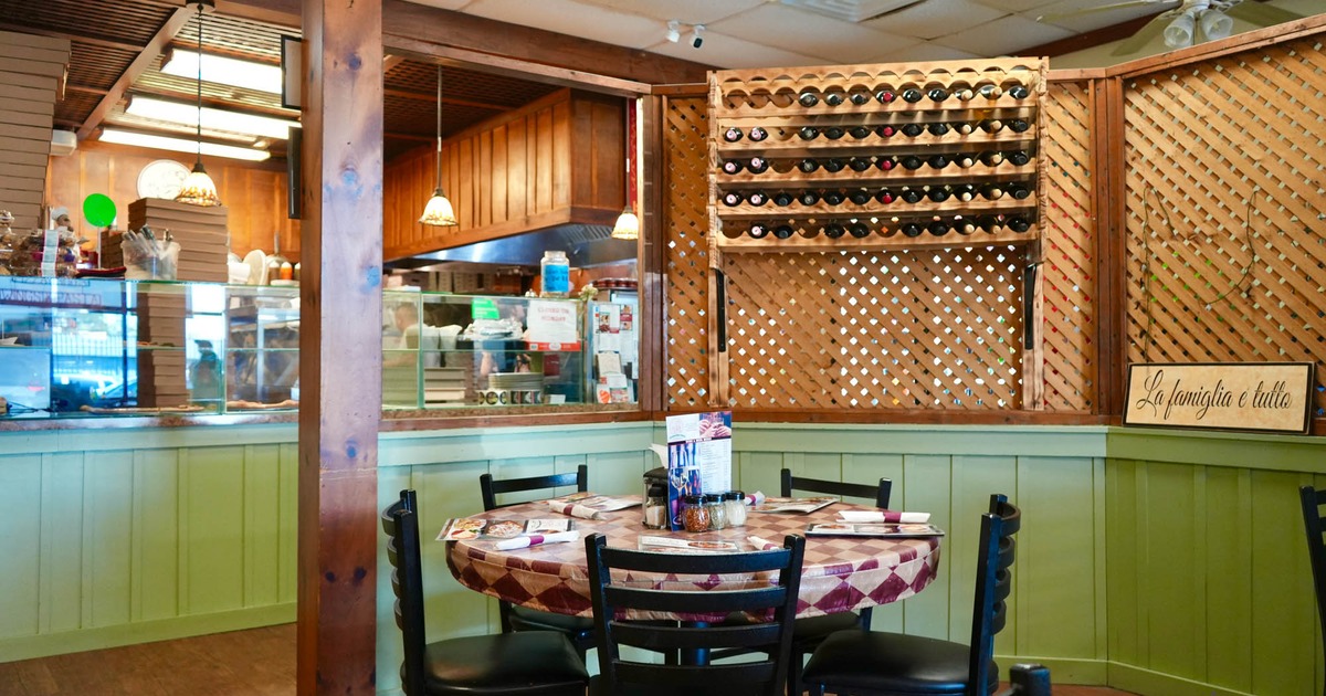 Interior seating area with table and chairs for five people