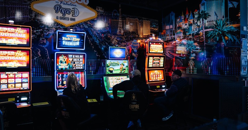 Interior, patrons playing slot machines
