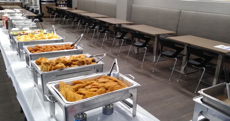 Interior, buffet tables with food in chafing dishes