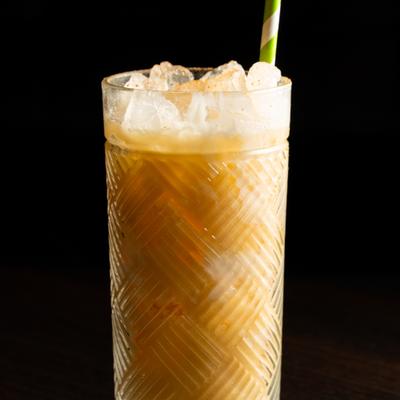 Painkiller cocktail served in a highball.