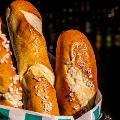 Philly pretzels in paper lined basket, close-up.