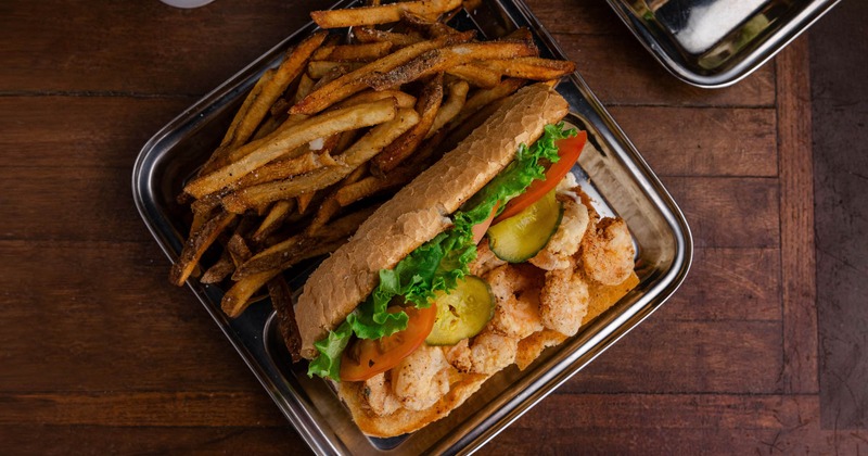 Shrimp Po' boy sandwich served with fries