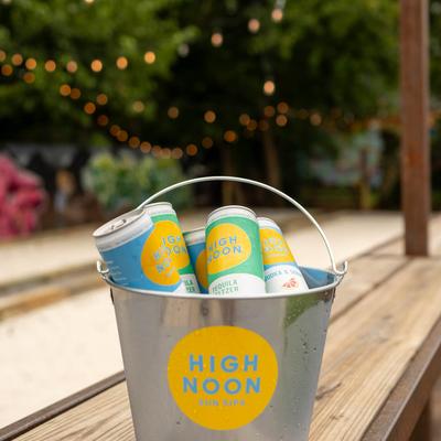 Beer cans in a bucket.