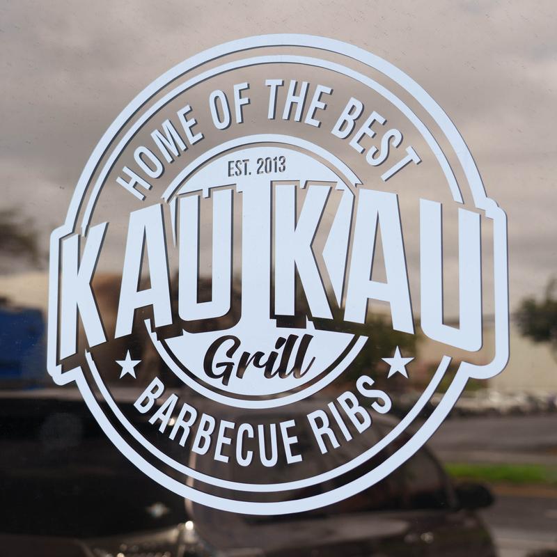 The restaurant's sign in the window.