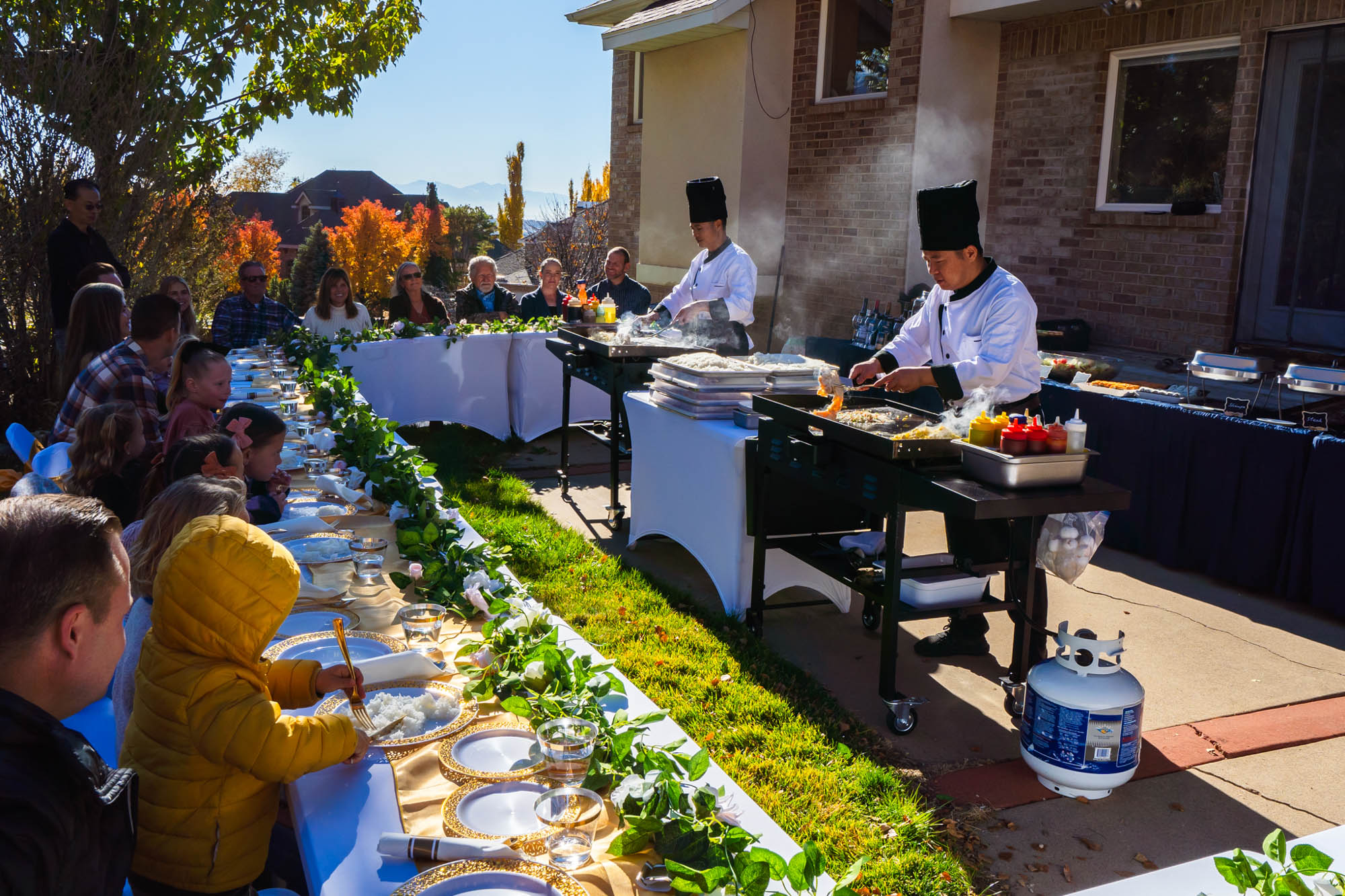 Outdoors, chefs preparing food
