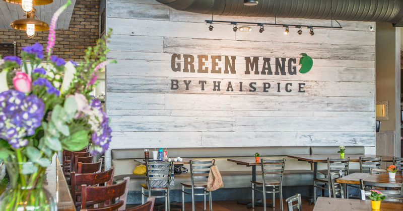 Interior, tables and logo on the wall