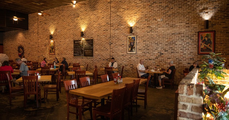 Interior, tables and seats with guests dining