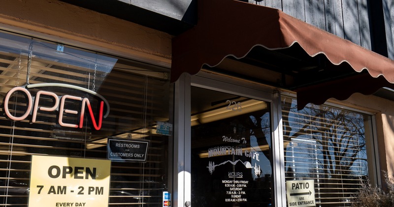 Exterior, angle view to entrance, sign