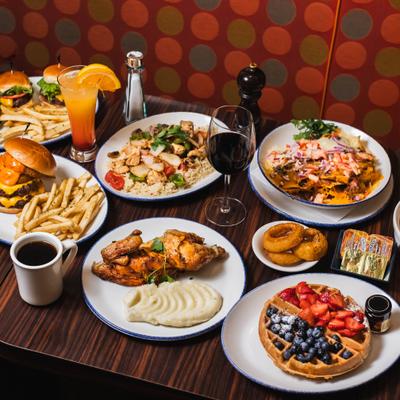 Assortiment of dishes served on the table with drinks.