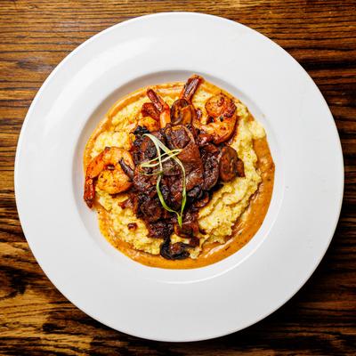 Shrimp and grits with mushrooms and caramelized onions.