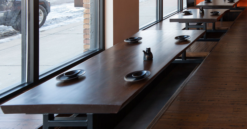 Interior, oriental style seating area with tableware