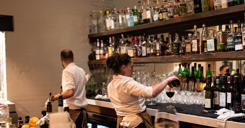Employees working at the bar