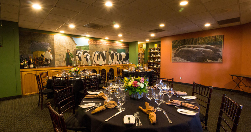 Interior, table ready for guests in a decorated seating area