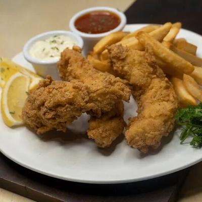 Fried chicken, with fries, and dipping sauces.