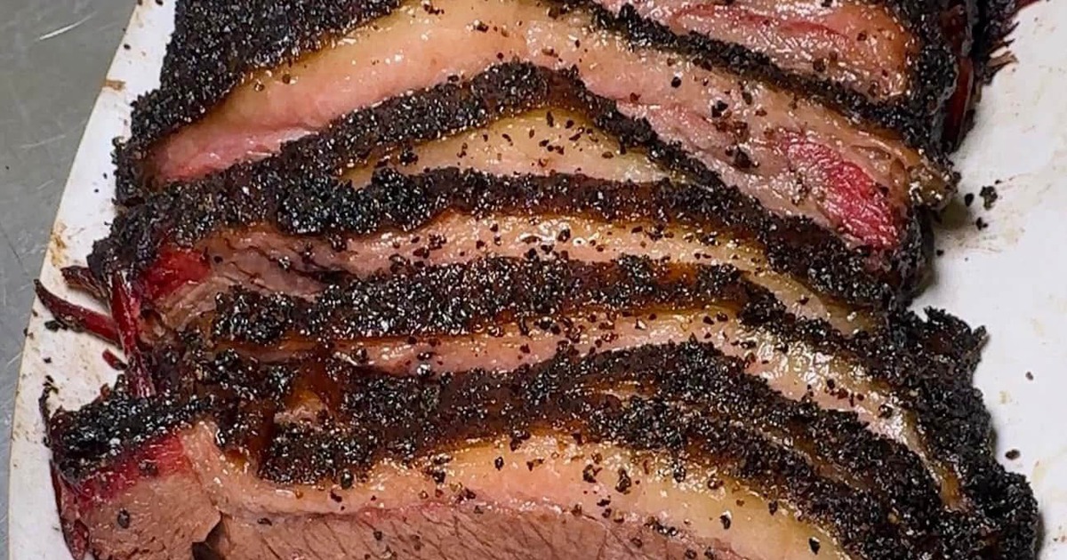 Sliced smoked brisket with peppered bark