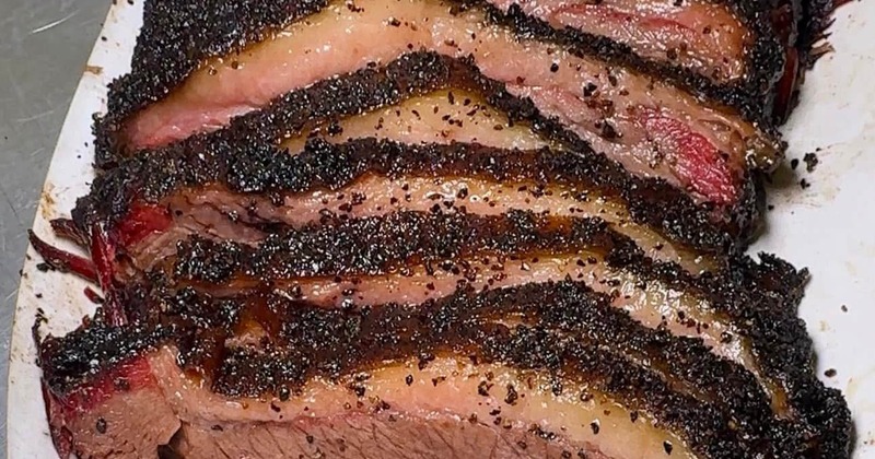 Sliced smoked brisket with peppered bark