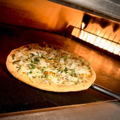 A pizza baking in an oven.