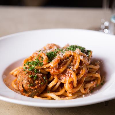 Pasta with meatballs and herbs.