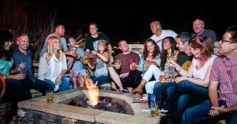 People gathered around the fire pit