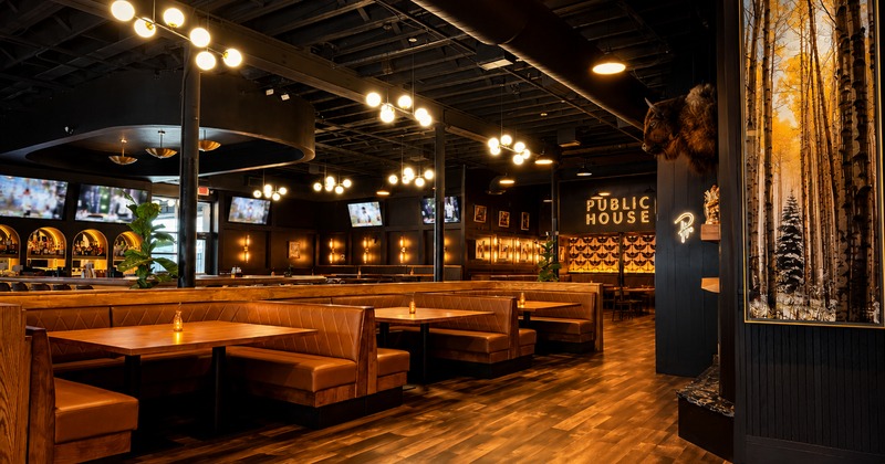 Interior, leather booths, wooden tables, industrial light fixtures, decoration