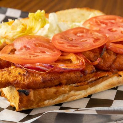 Hot and Sweet Crispy Chicken Sandwich with tomato slices and lettuce.