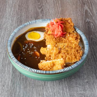 Breaded chicken curry with egg and pickled ginger.