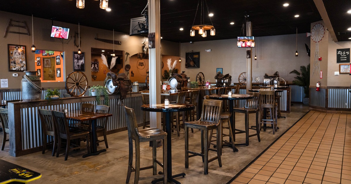 Interior with tall tables and bar stools