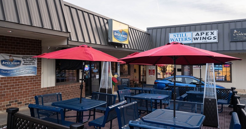 Exterior, tables with parasols and chairs