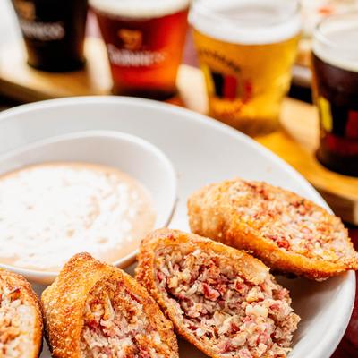 Reuben egg rolls with dipping sauce.