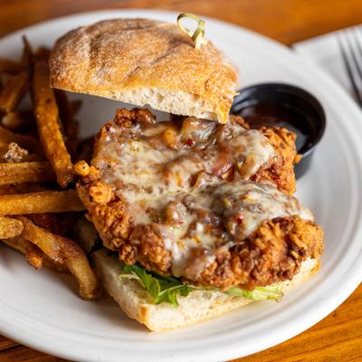 Fried chicken sandwich with fries.