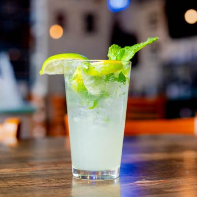 Mojito cocktail with mint and lime garnish.