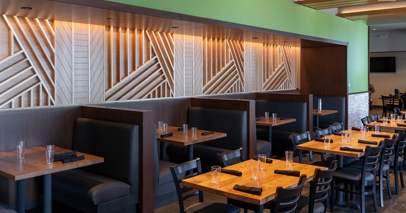 Interior, restaurant booths and lined up tables