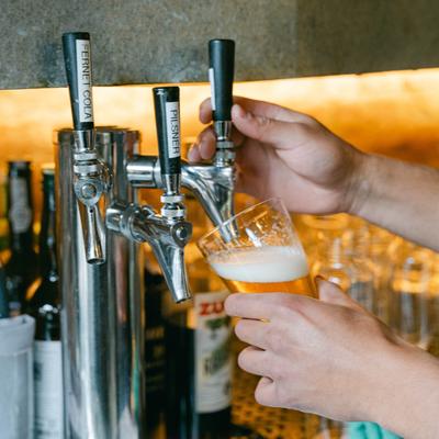 A draft beer being poured at Table Asheville..