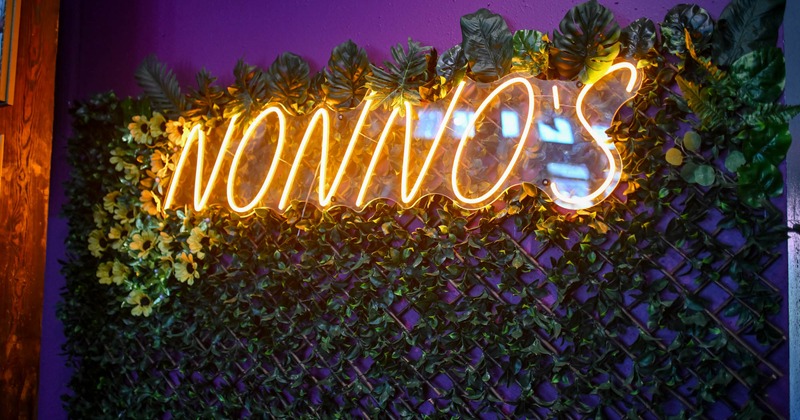 The restaurant's name in neon lights