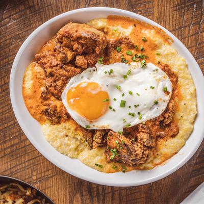 Cajun-fried chicken livers with grits, fried egg, and herbs