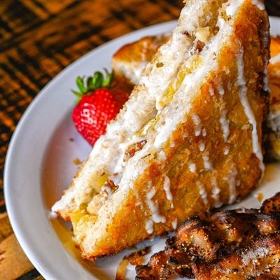 Stuffed French Toast with a strawberry on the side.