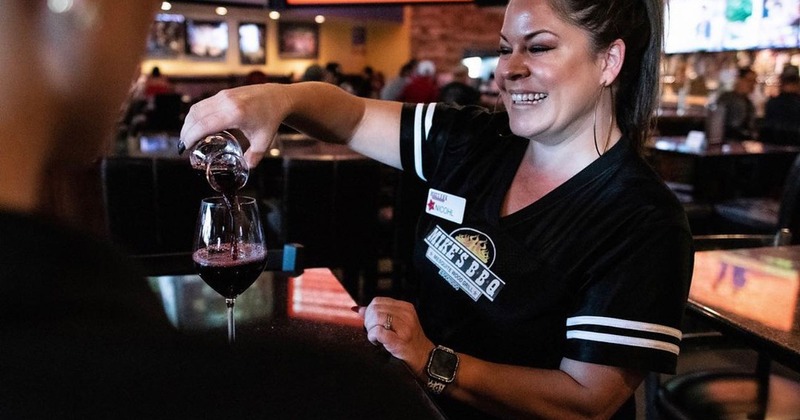 Employee pouring draft beer