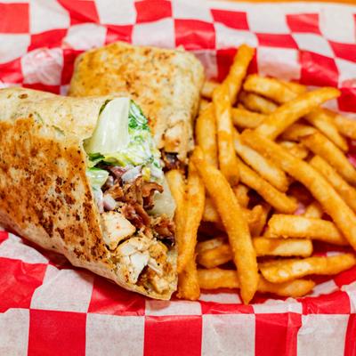 Chicken Cesar wrap with fries.